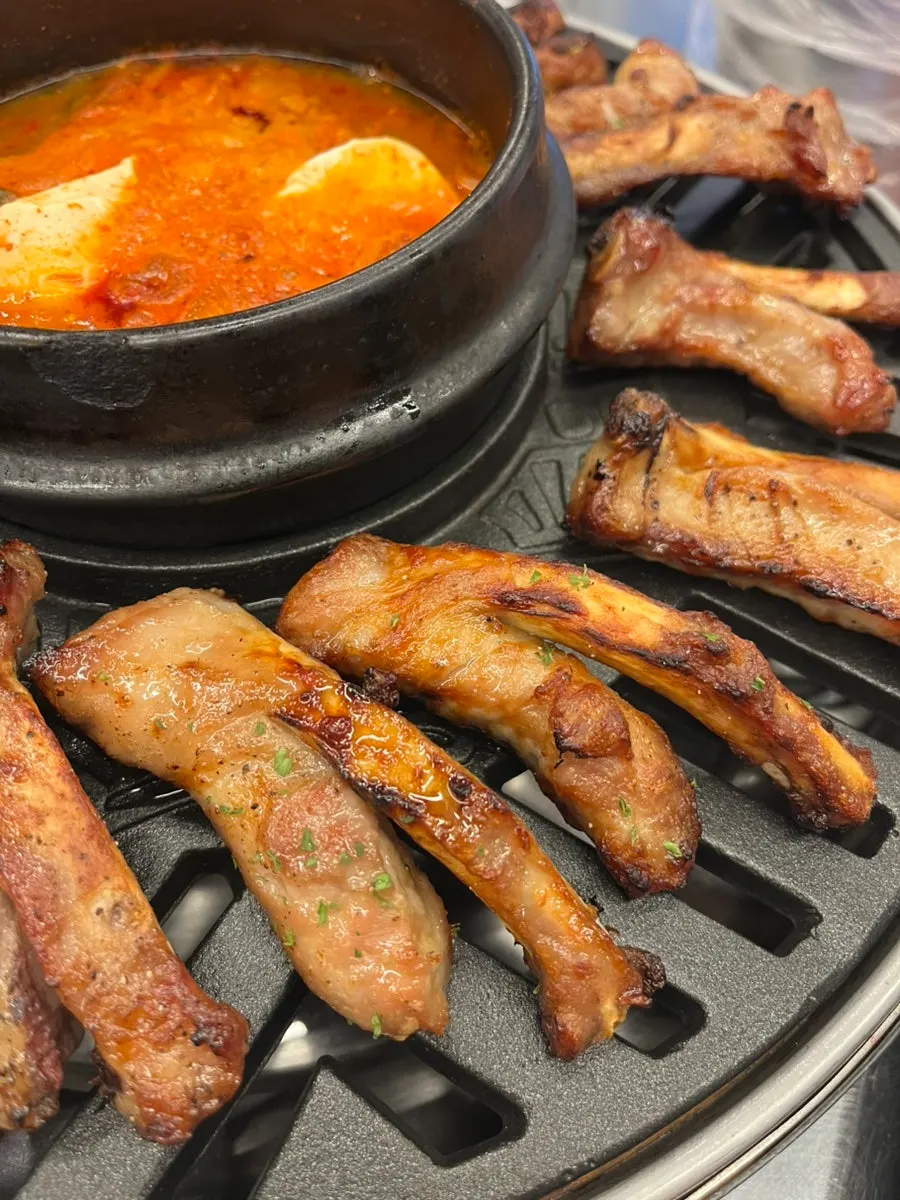 Picking meat off the bone from jjokgalbi