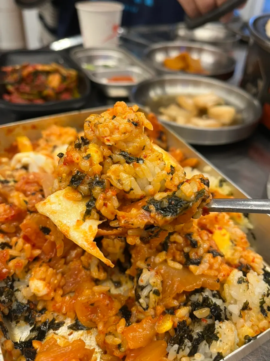 Retro lunchbox with stir-fried kimchi and pink sausage