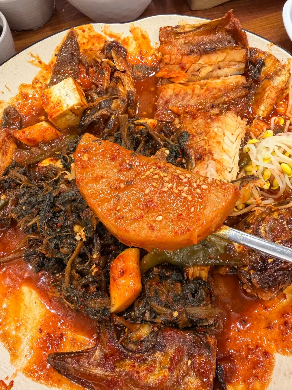 Braised pollock served with sauce-soaked radish