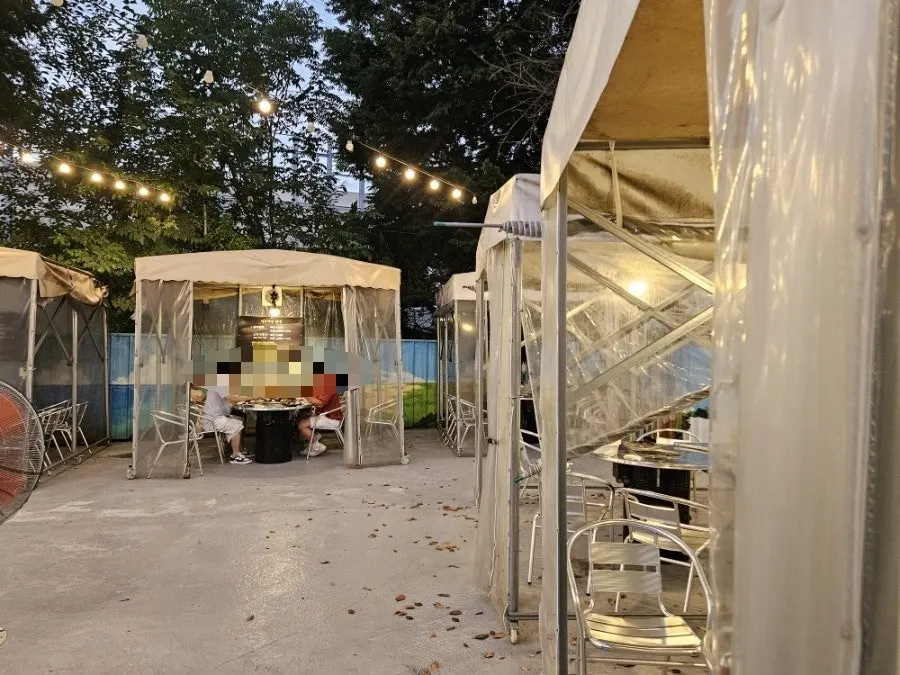 Inside a camping-style outdoor tent