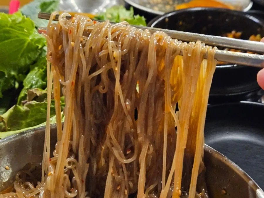 Table set with pork belly and naengmyeon