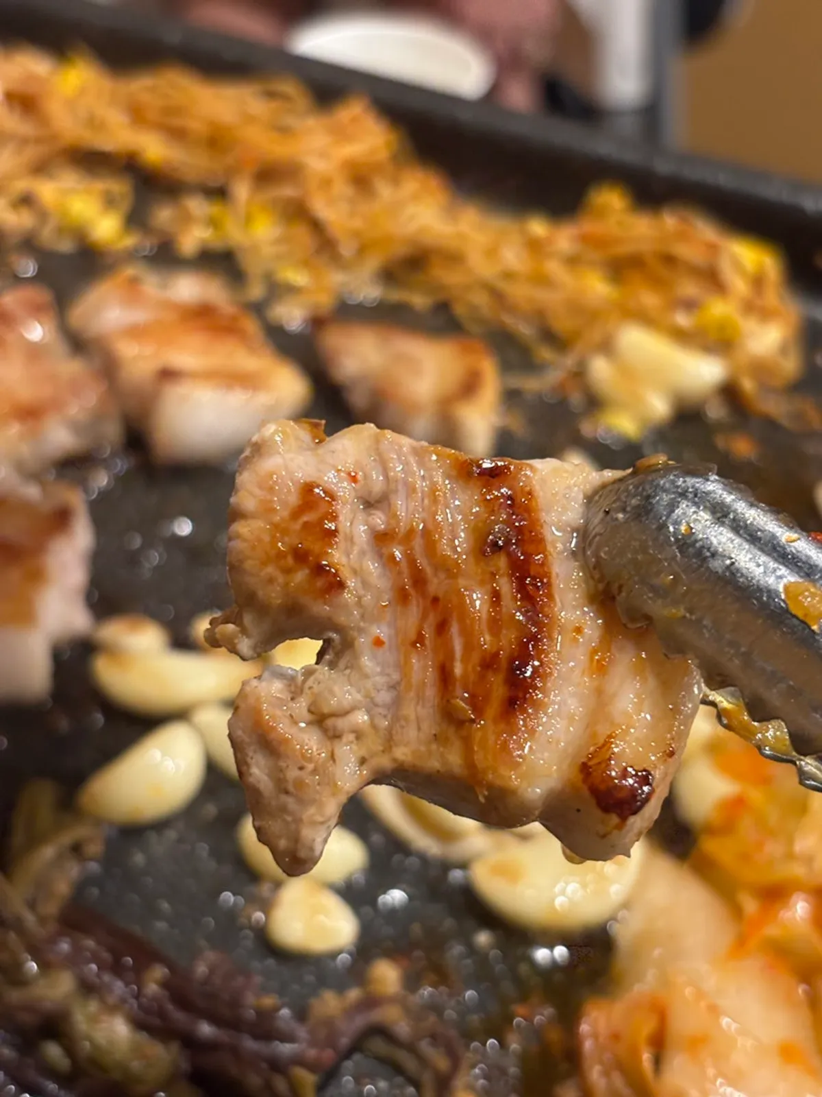 A cross-section of well-grilled pork belly at the right thickness