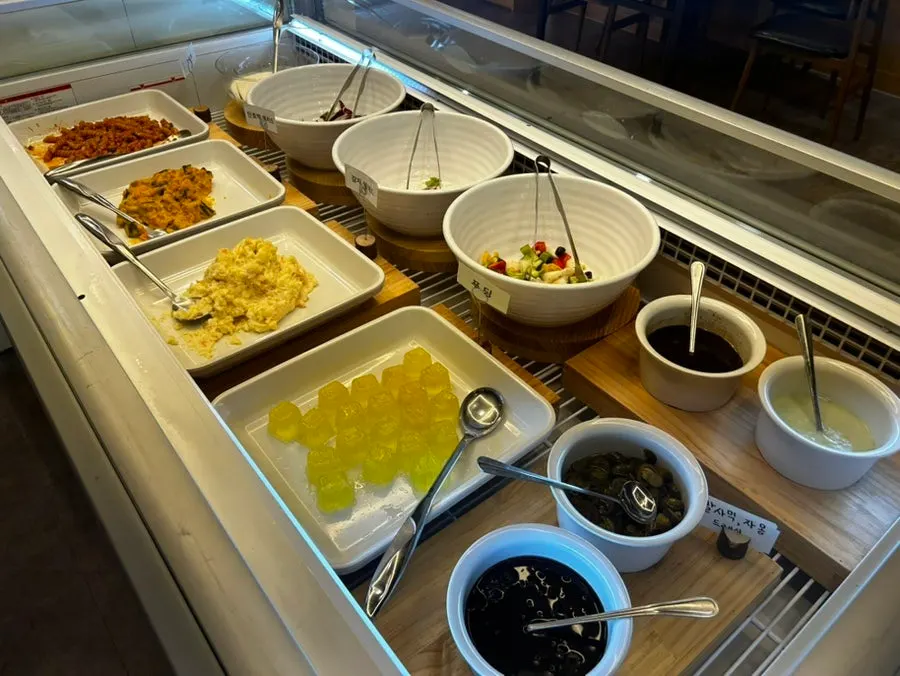 Salad bar corner with about 20 different dishes