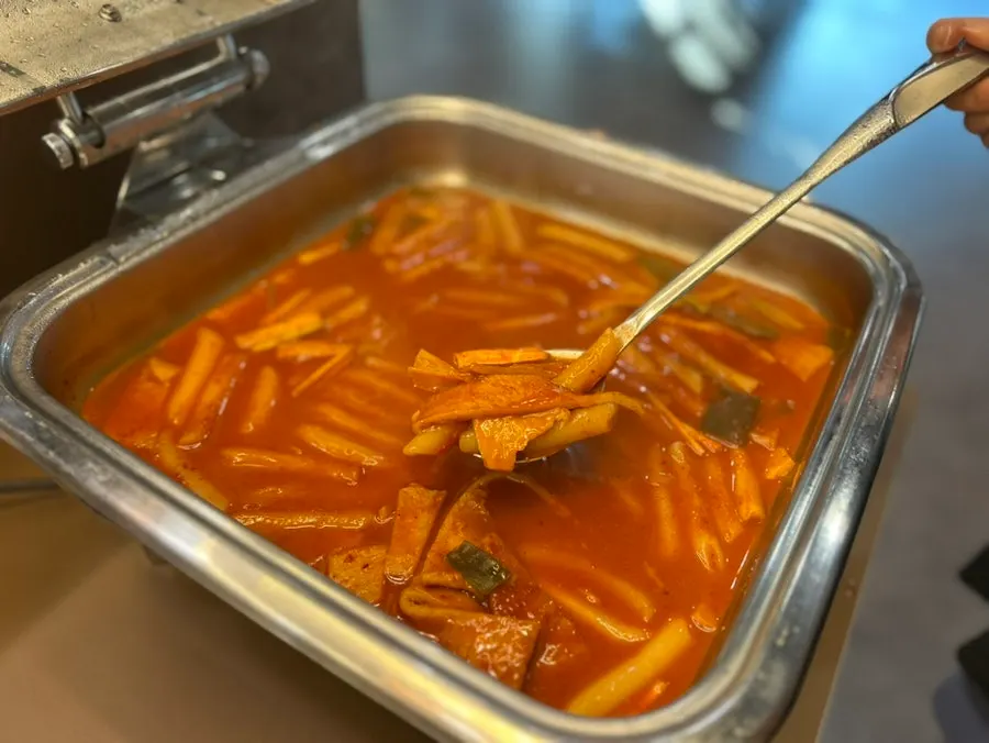 The warm food section of the salad bar