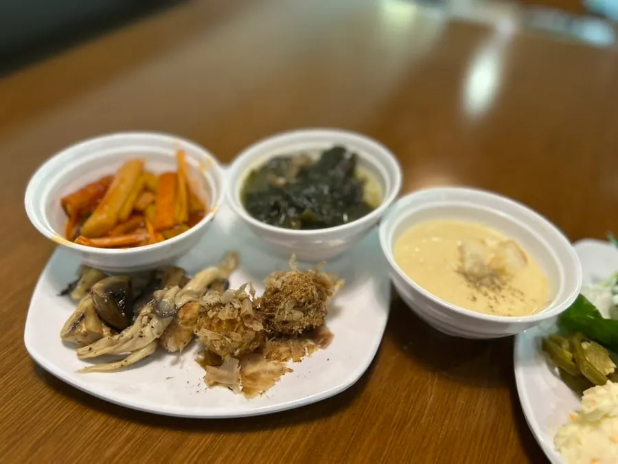 Salad bar dishes laid out on the table