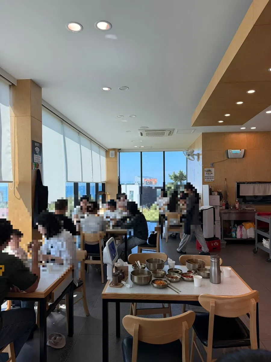 Interior of Handam Guksu Gwakji Aewol Branch packed with customers