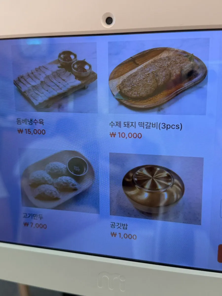 Menu board with dombe cold boiled pork and side dishes