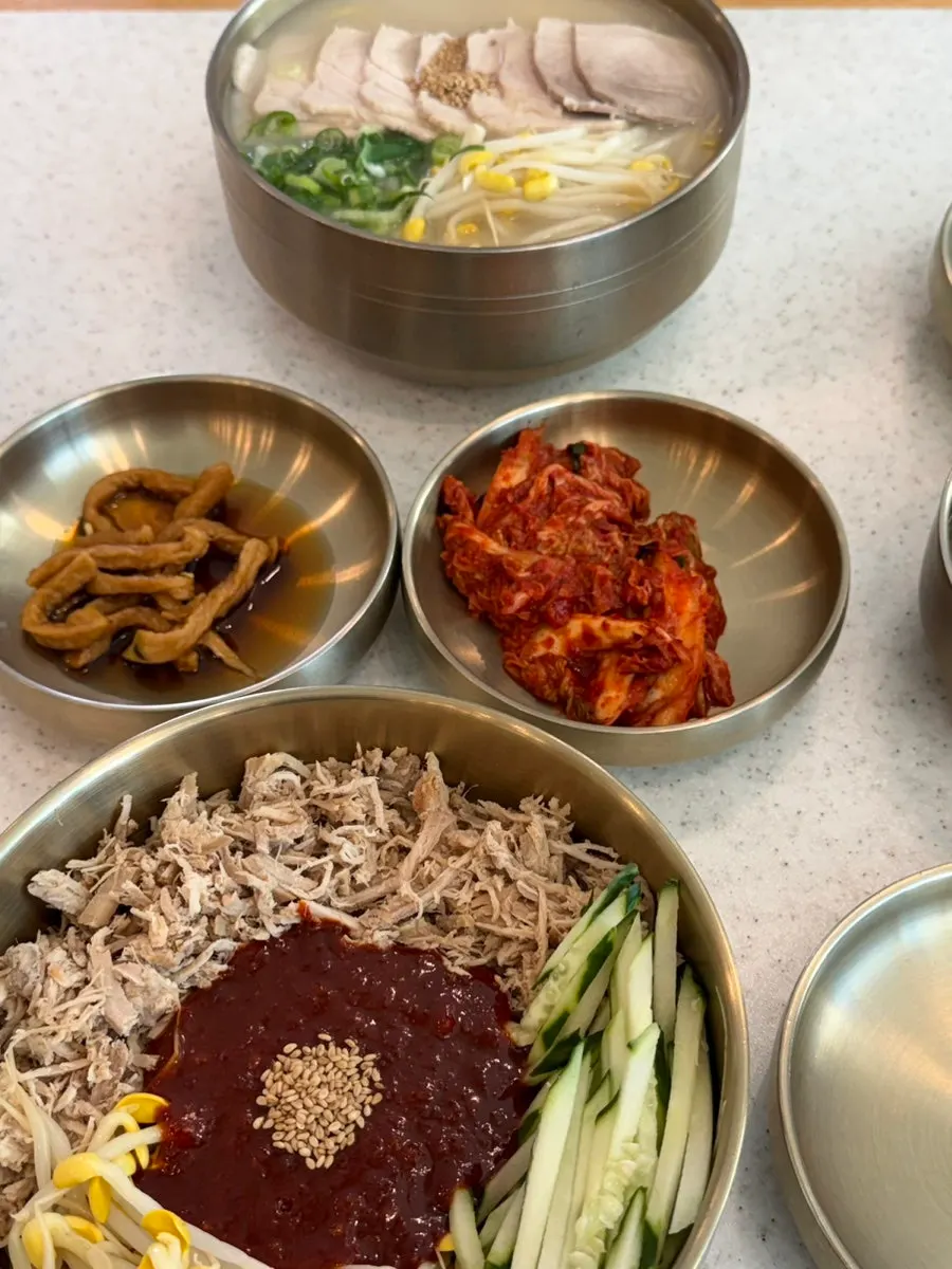 Table setting with side dishes alongside the noodles