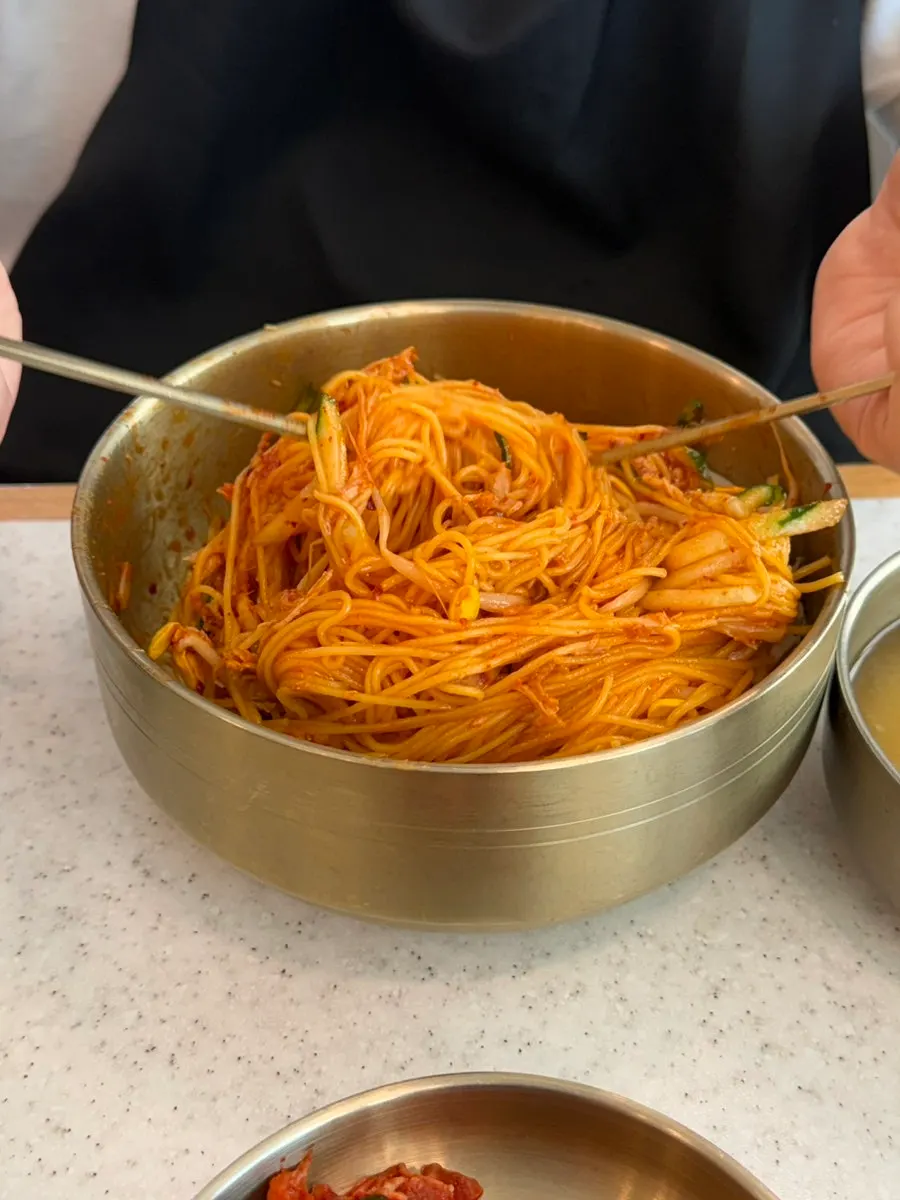 Dongchimi broth served alongside the bibim noodles