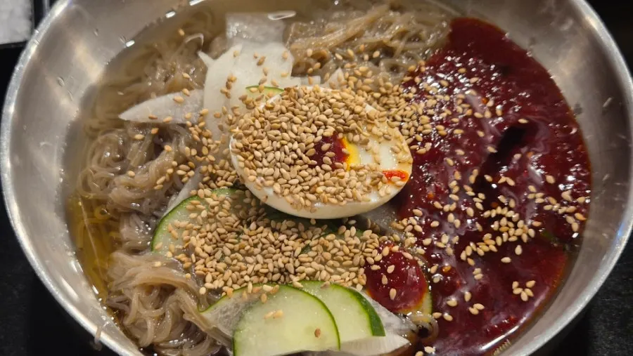 Bibim naengmyeon served alongside the meat