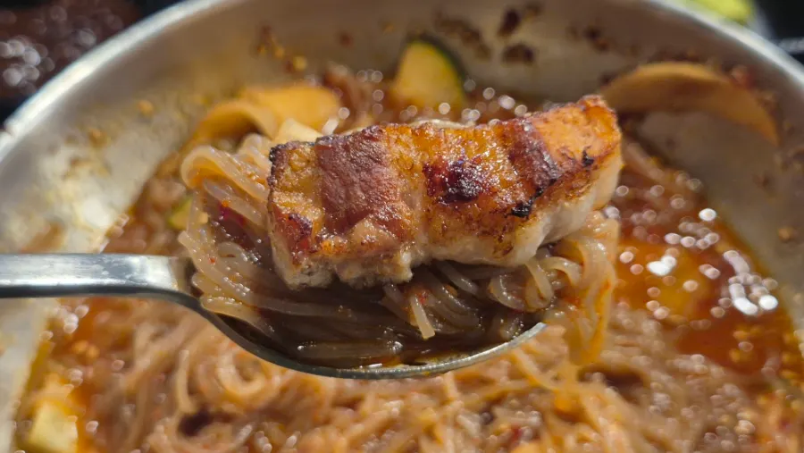 Well-mixed bibim naengmyeon with meat