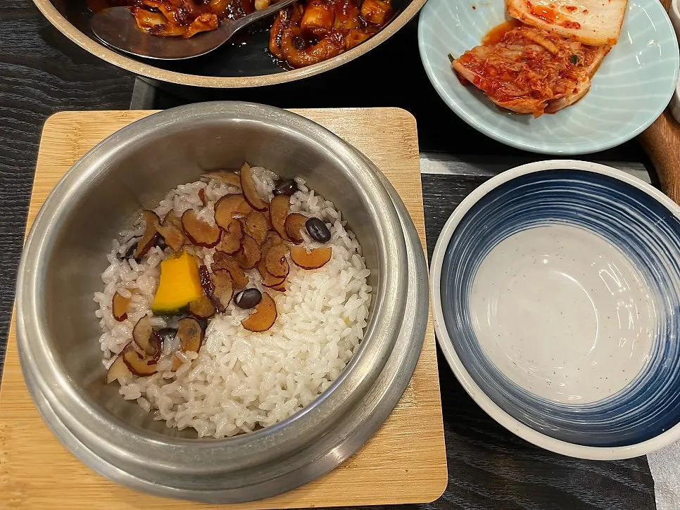Side dish spread with salad, jellyfish salad, japchae, and kimchi