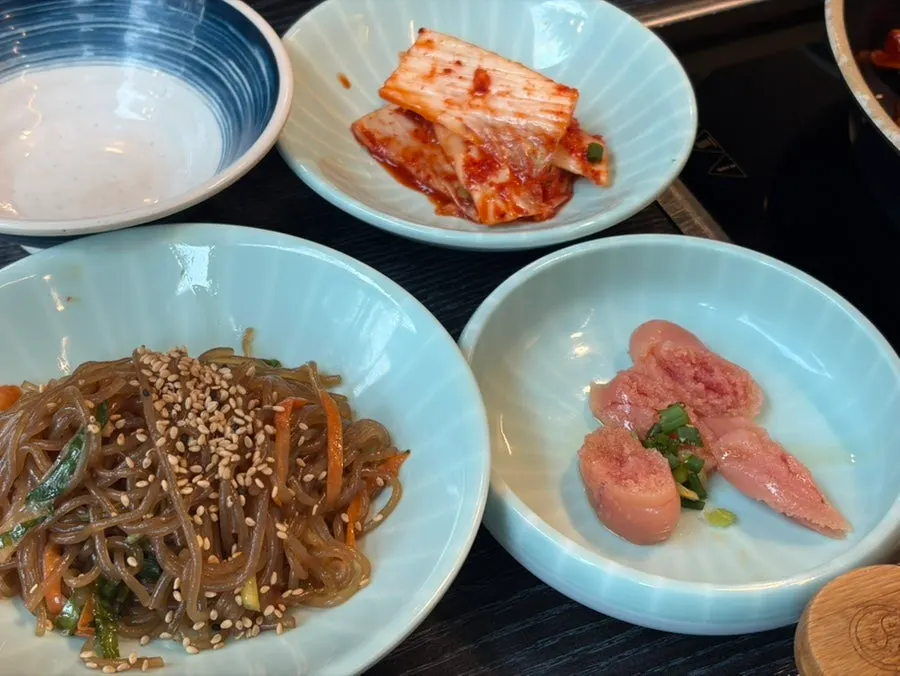 Table filled with jjukkumi and side dishes