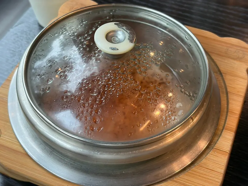 Hot pot rice scooped into a bowl