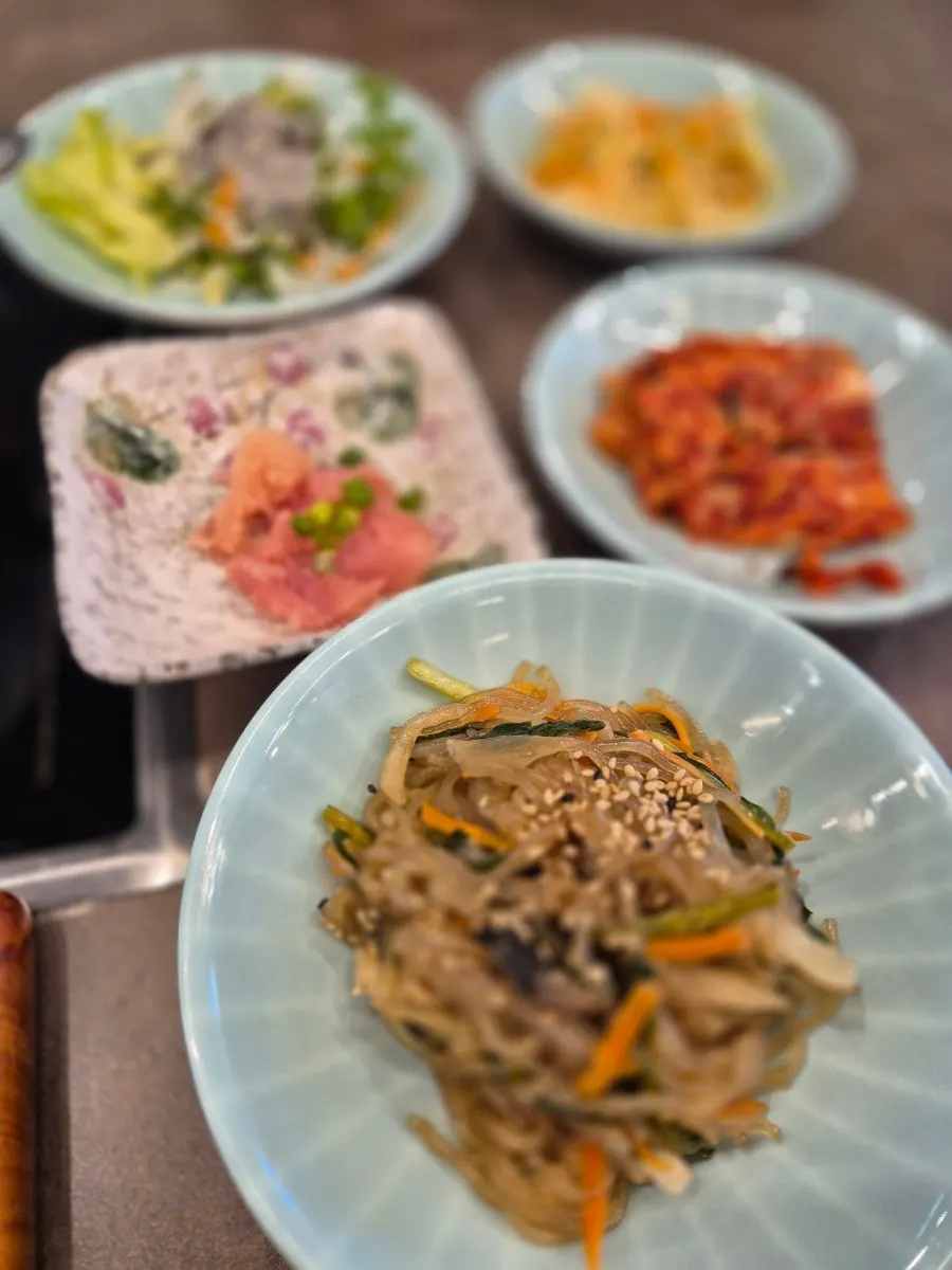 Japchae and salad served with the set meal