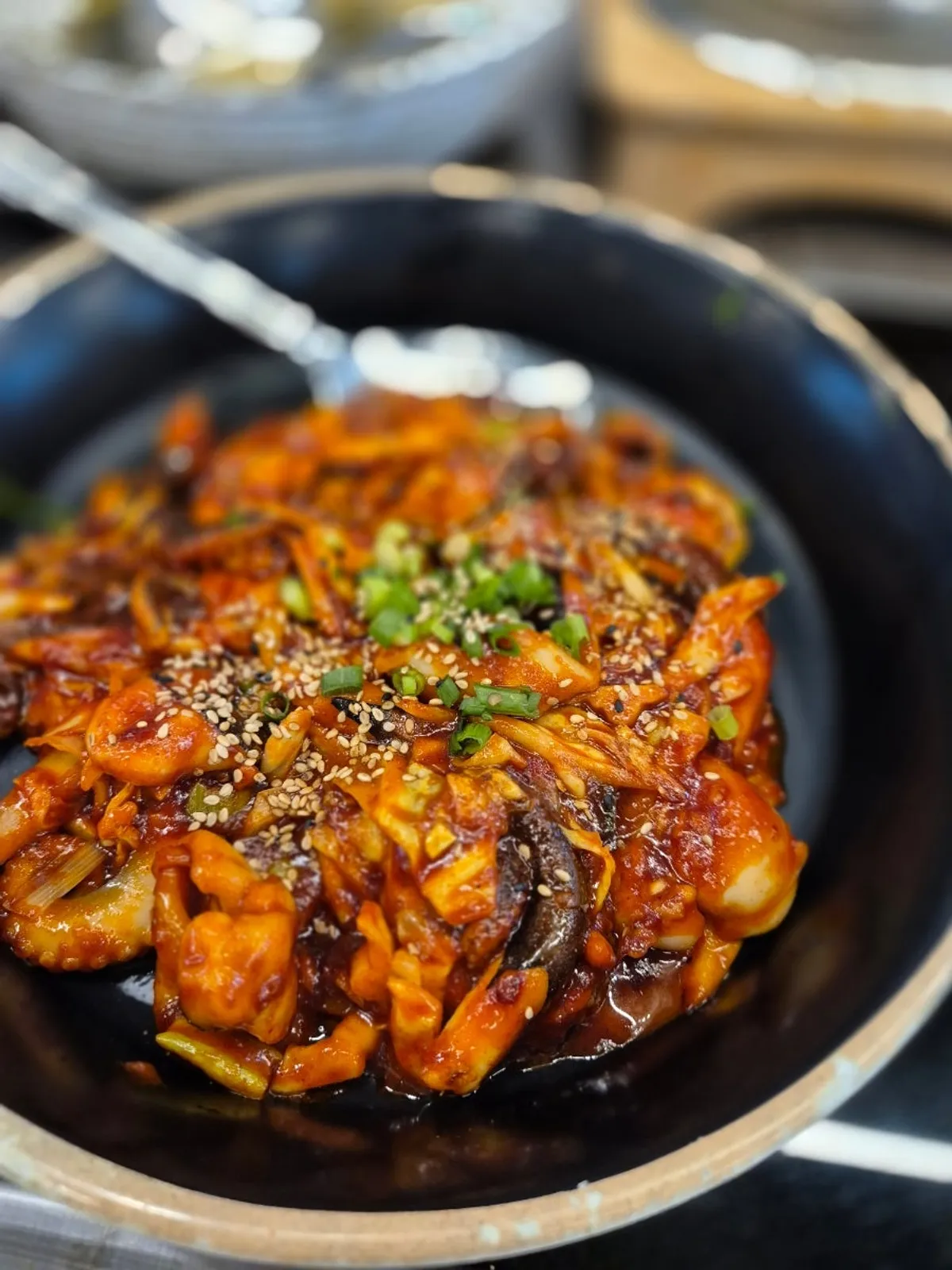 Perilla-oil jjukkumi served on a hot plate