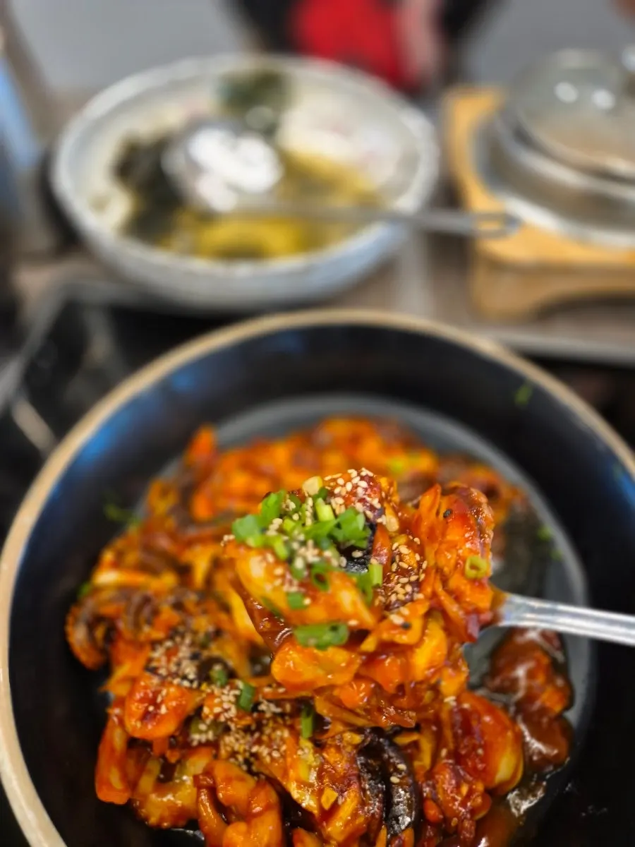 A full spread of perilla-oil jjukkumi and hot pot rice