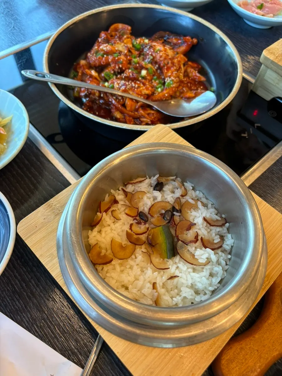 Full table spread with stone-pot rice and jjukkumi set