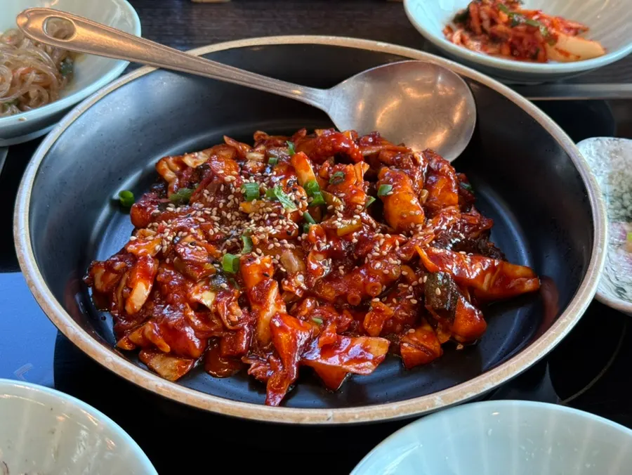 Table with banchan and hot pot rice together