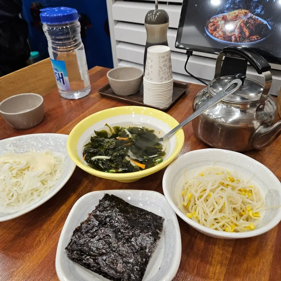 Banchan served alongside the braised pollock