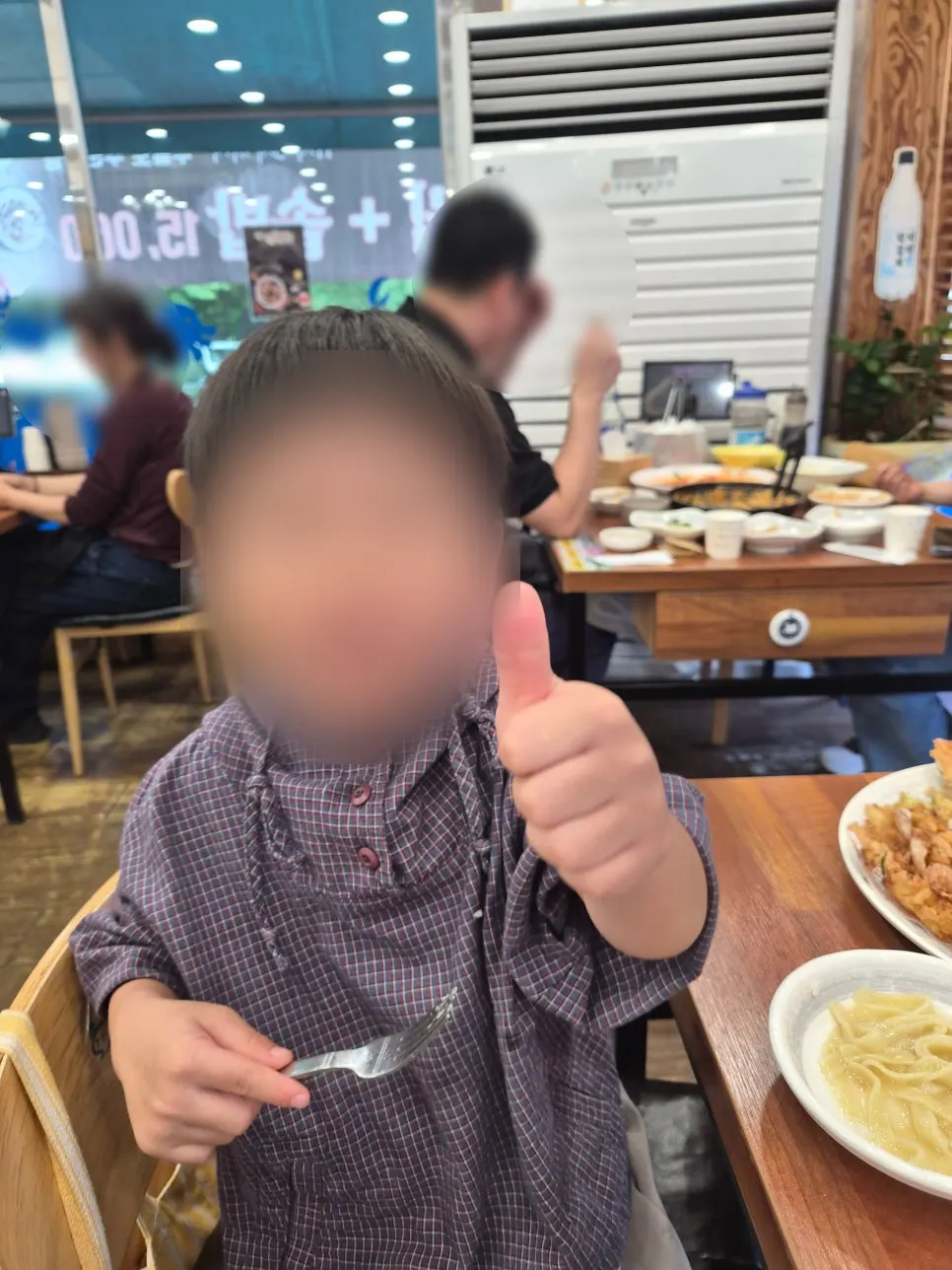 Child eating kalguksu