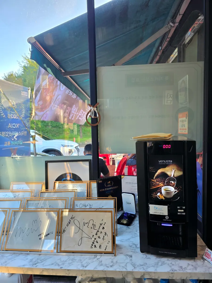 Coffee corner and celebrity autographs on one side of the restaurant