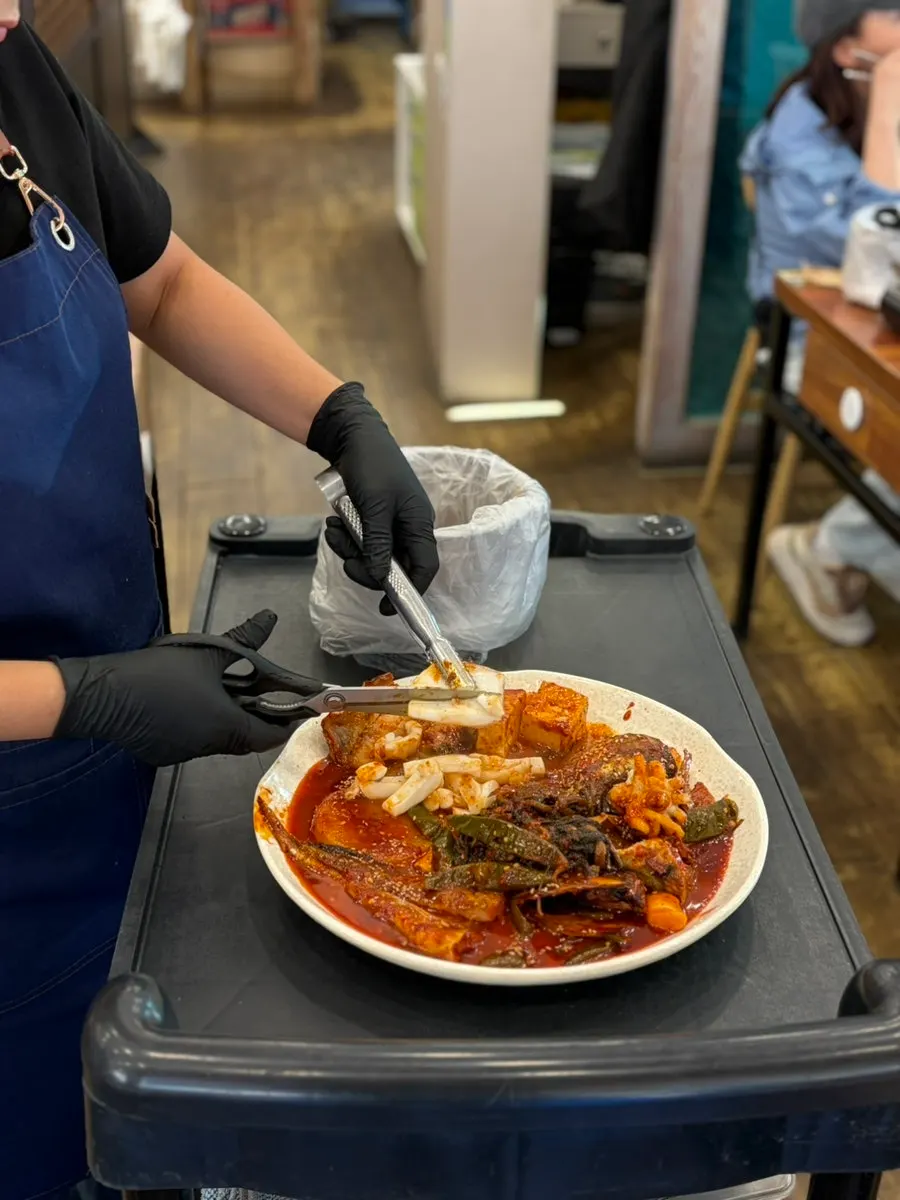 Braised dish with two pollock and cuttlefish on top