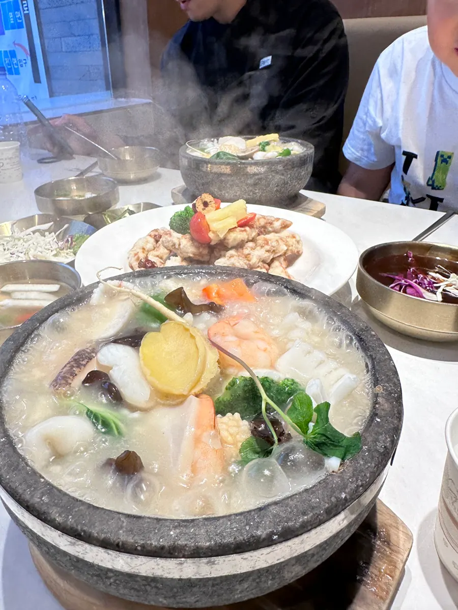 Vertical shot of the bubbling abalone rice soup
