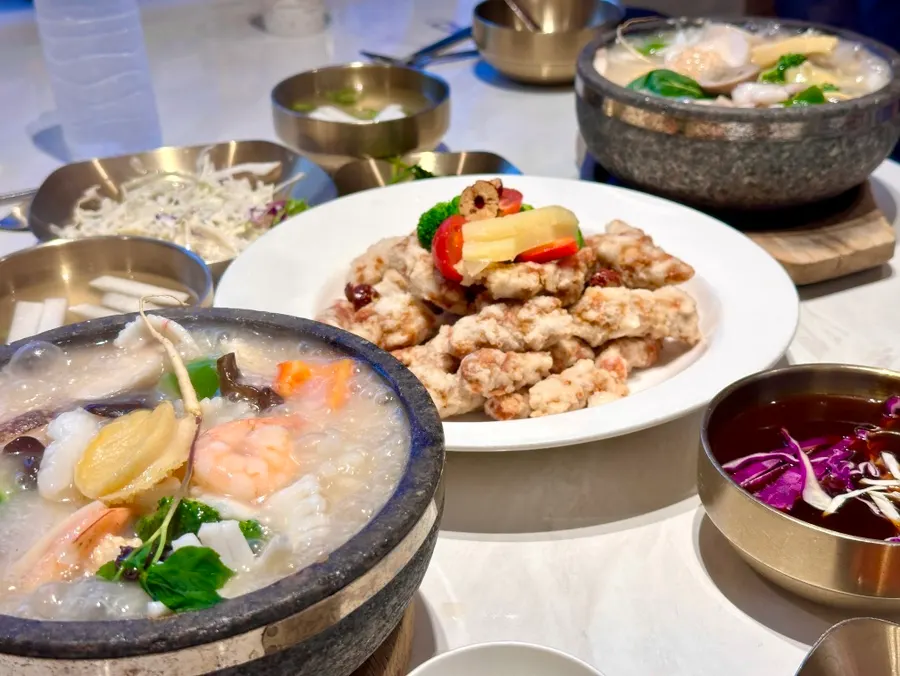 A spoonful of broth and crispy rice