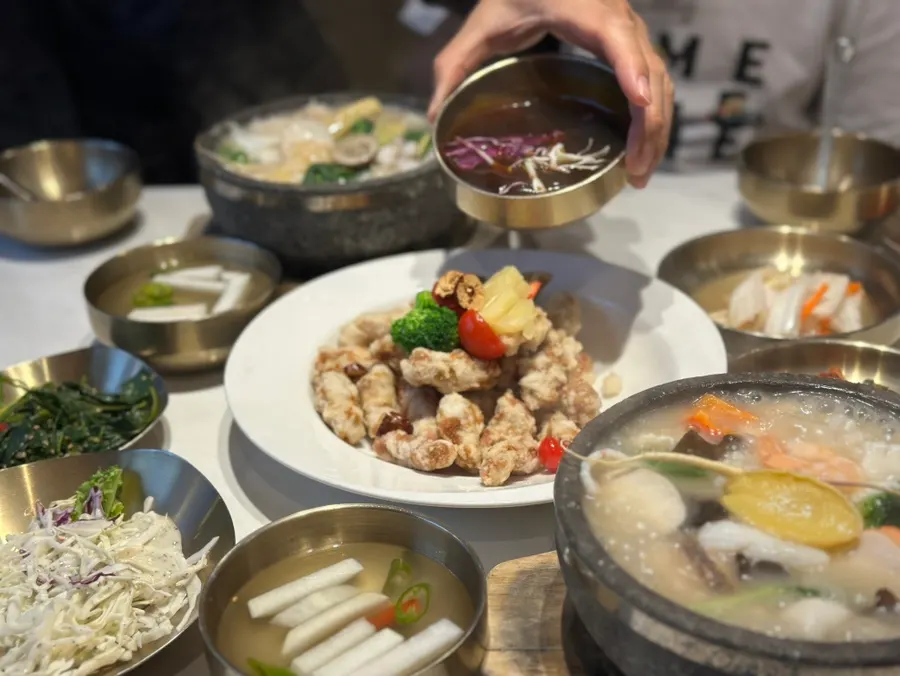 Abalone and seafood served together with the rice soup