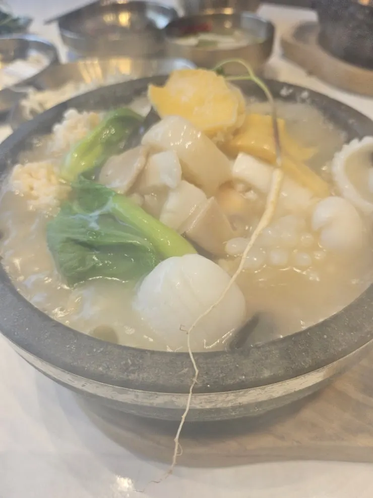 Stone pot rice soup staying piping hot