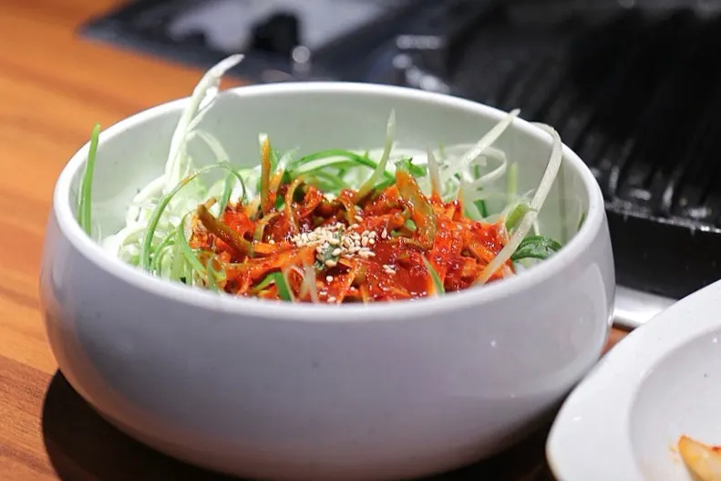 Unlimited refill doenjang stew served as a basic side