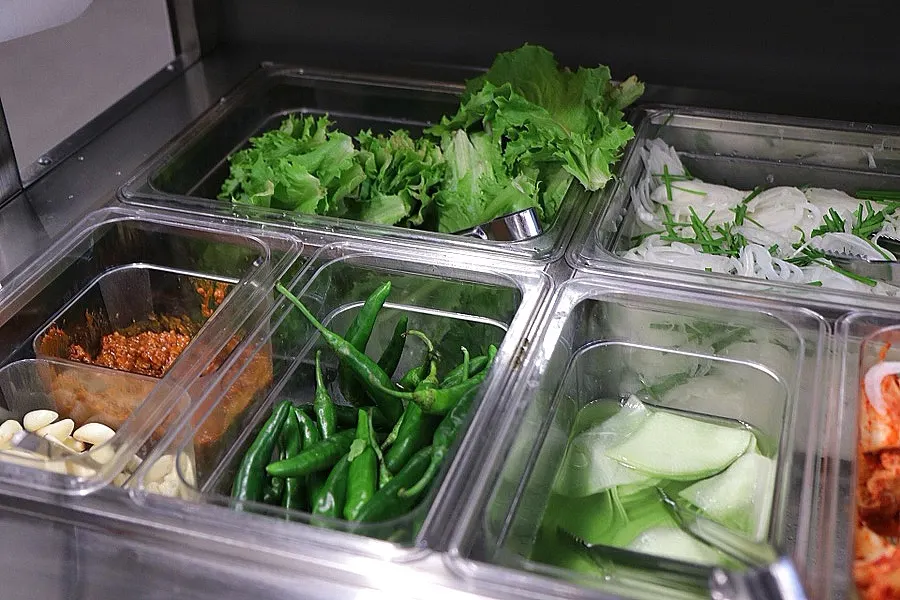 Self-serve side dish corner in the middle of the restaurant