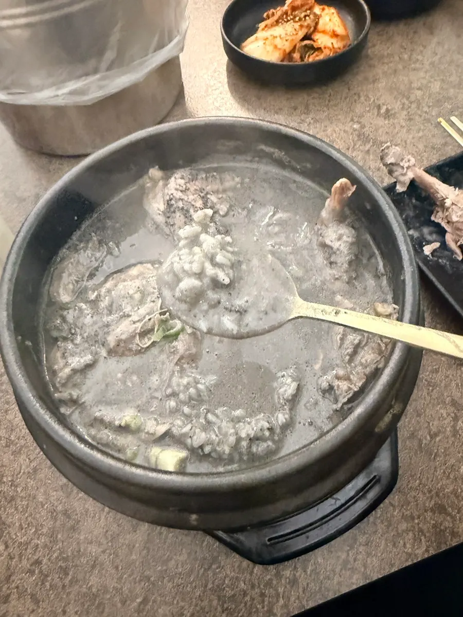 Black sesame samgyetang broth and chicken at Baekheukdam