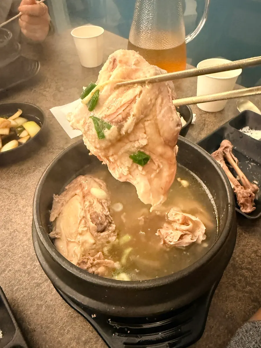 Herbal sous vide samgyetang broth with a chicken leg
