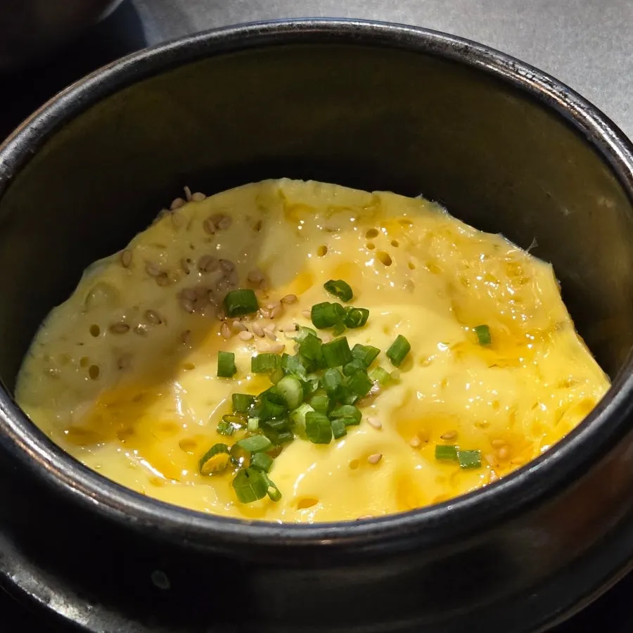 Seafood ssamjang in an earthenware pot with wrap vegetables
