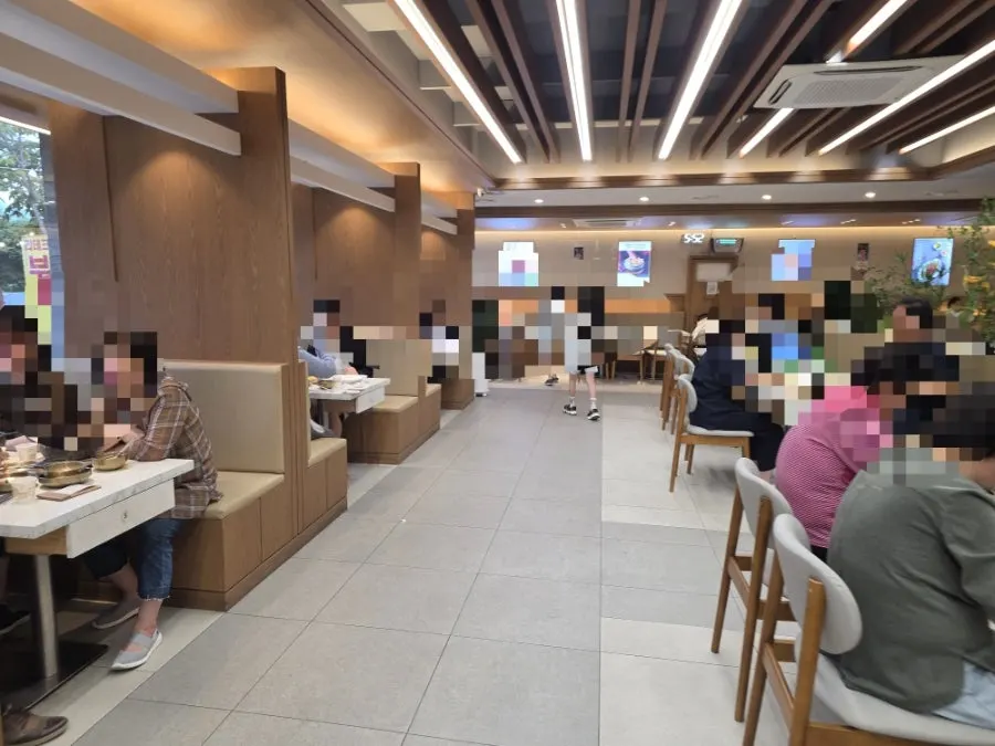 Wood-tone interior with tables inside the restaurant