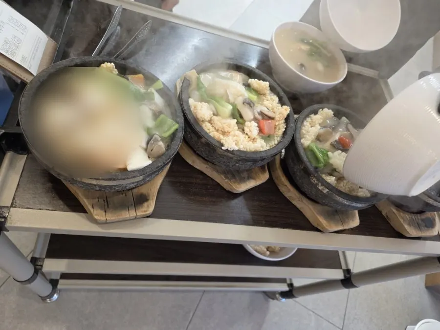 Seafood scorched rice soup served in a stone pot