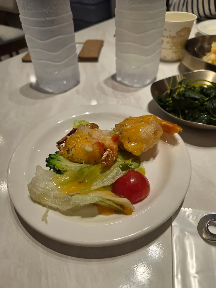Picking up a piece of chili shrimp