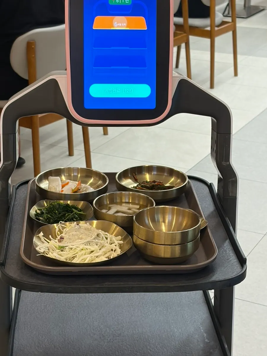 Cabbage salad and white kimchi among the side dishes