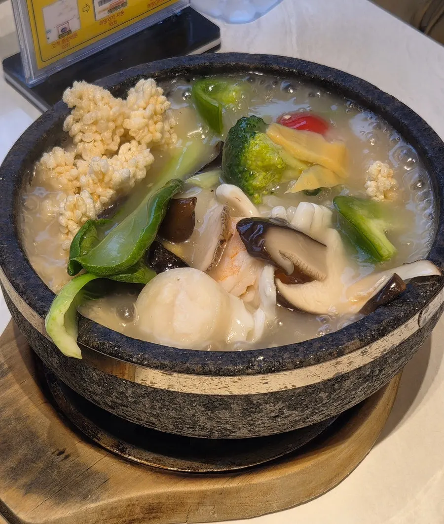 Close-up of the seafood abalone nurungjitang stone pot