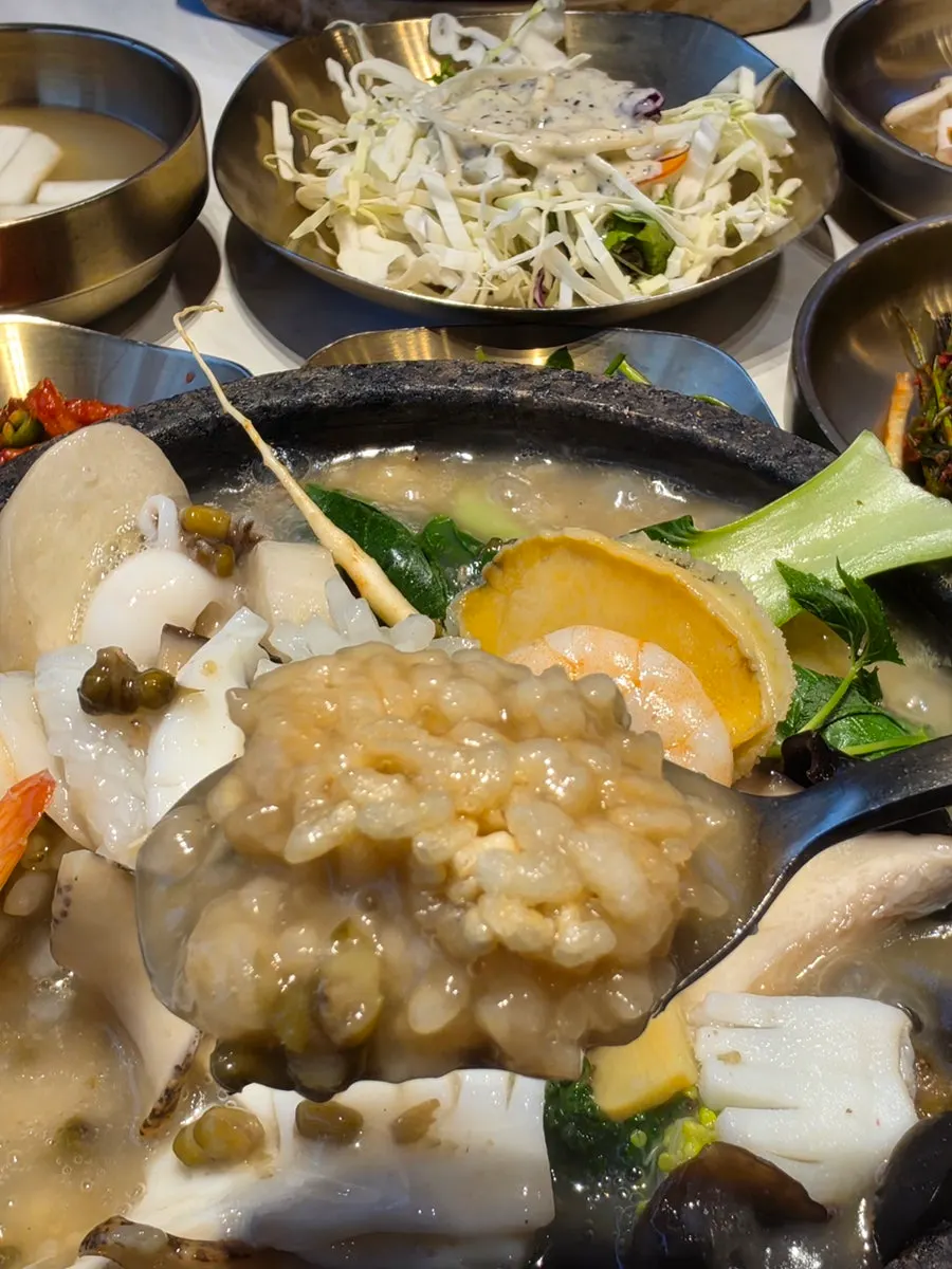 Scored squid visible in the seafood nurungjitang
