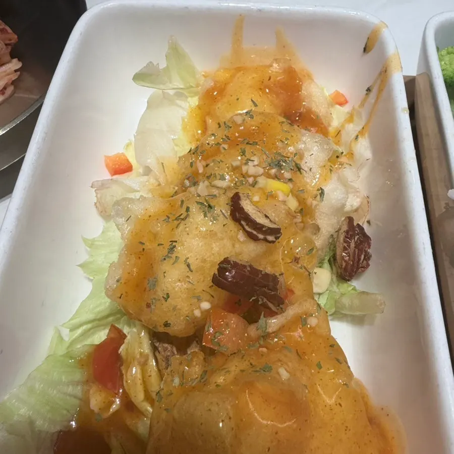 Chili shrimp served with lettuce