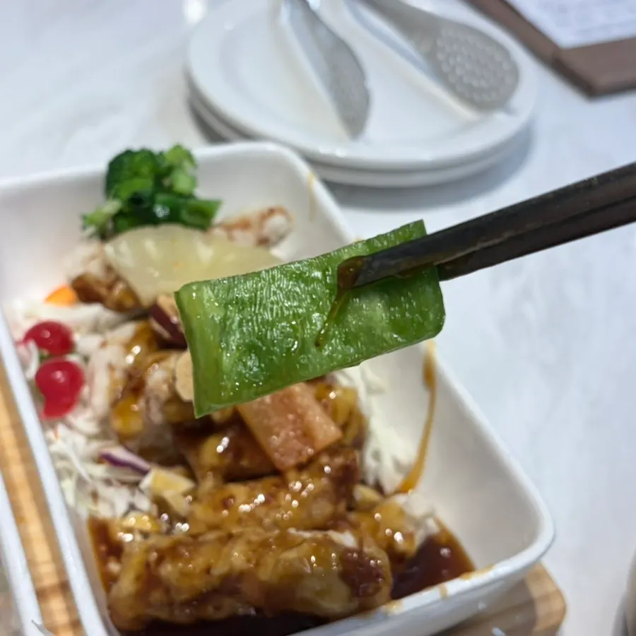 Plate of Chinese food piled with vegetables
