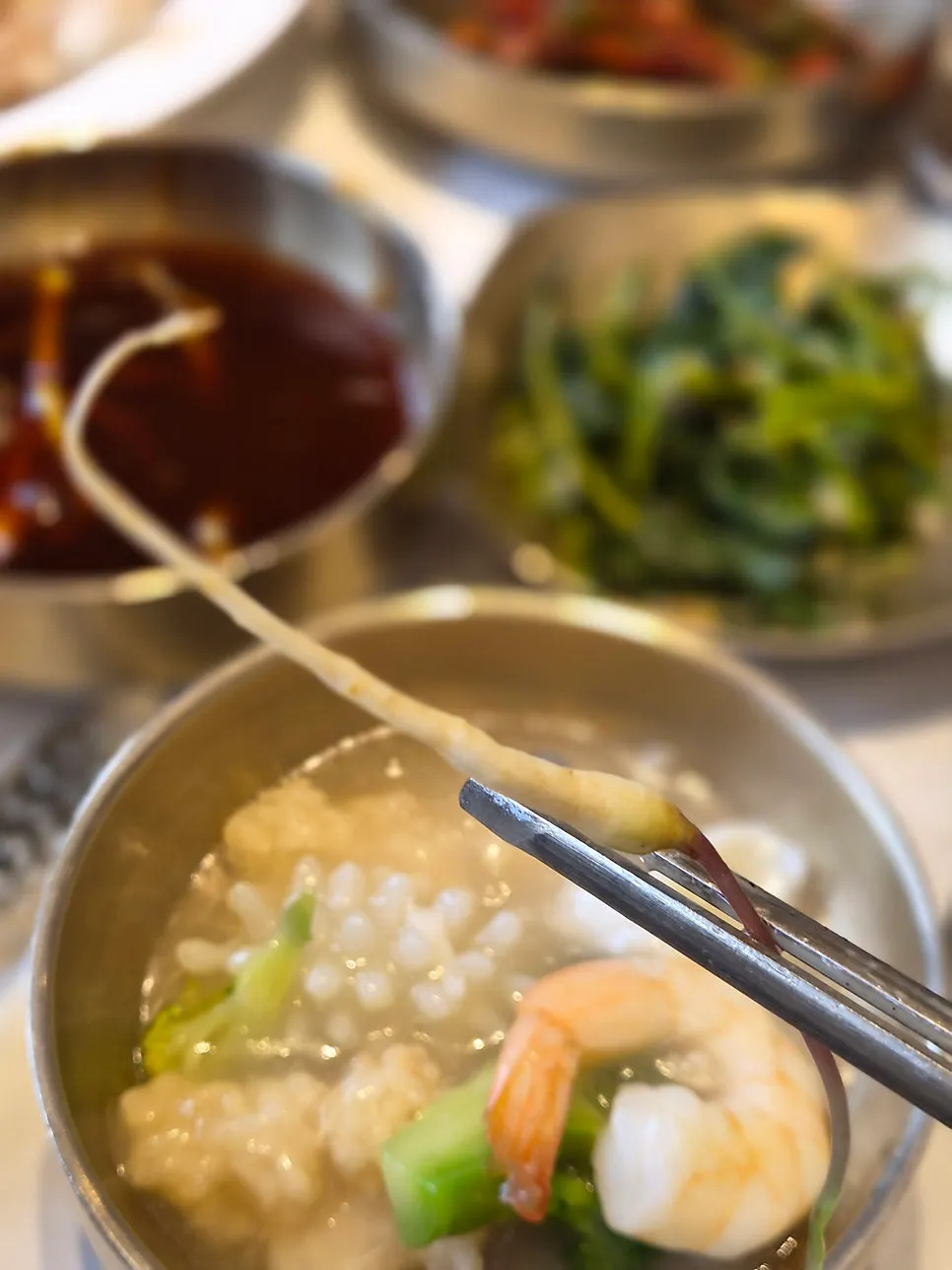 Individual servings of seafood and rice soup