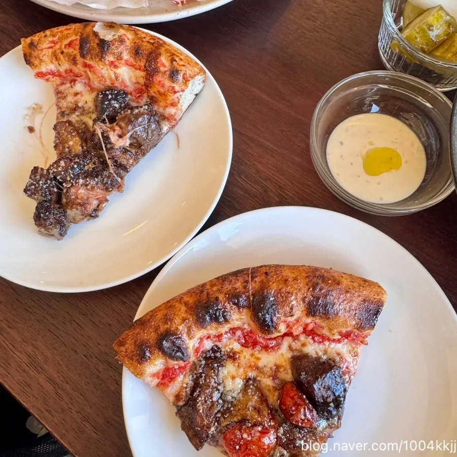 A slice of wood-fired Korean beef pizza