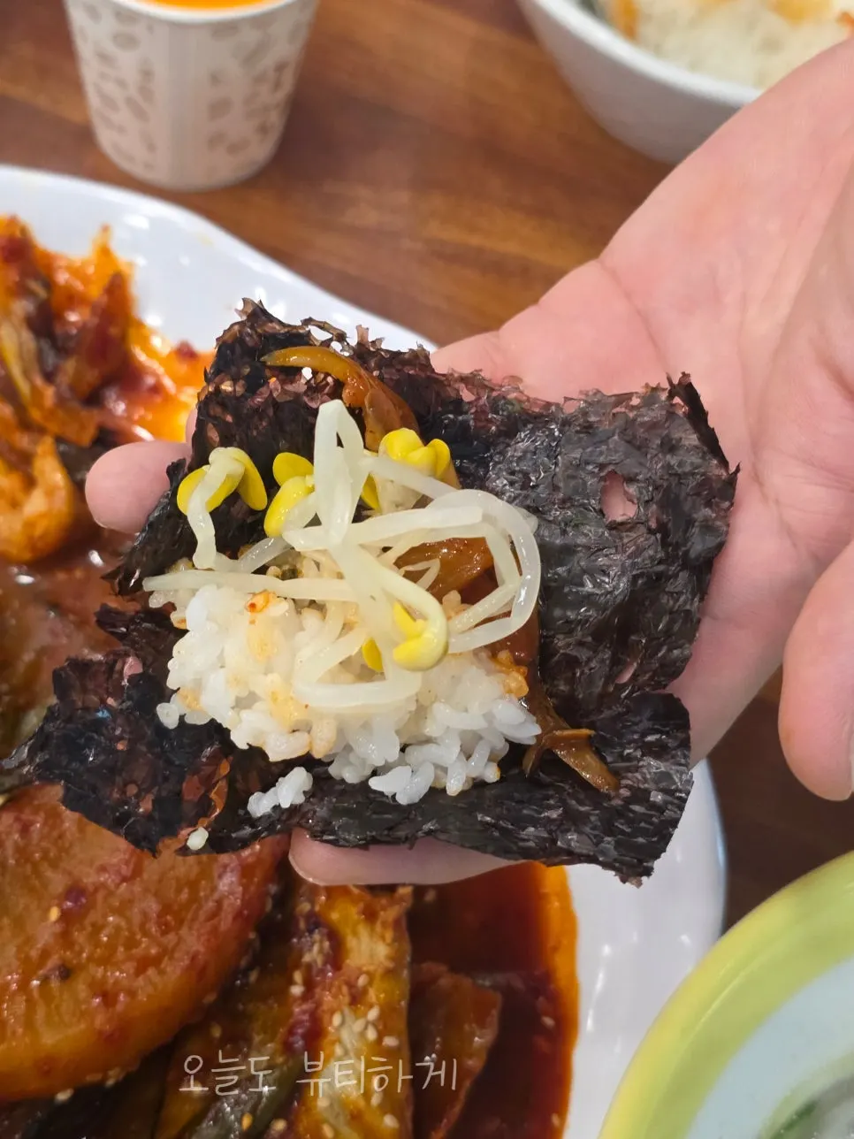 A bite of kodari-jjim wrapped in seaweed