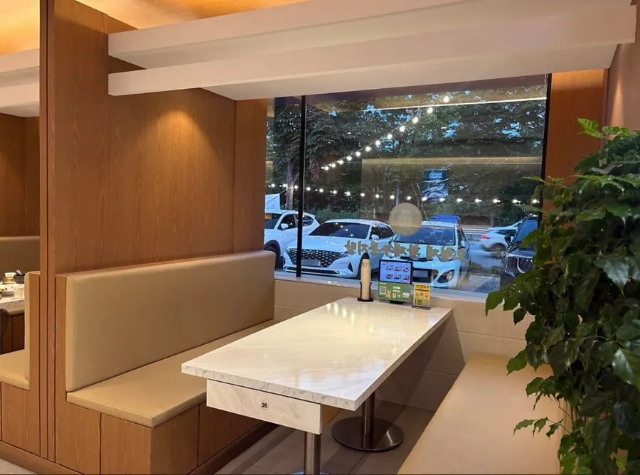 Interior dining hall with comfortably spaced tables