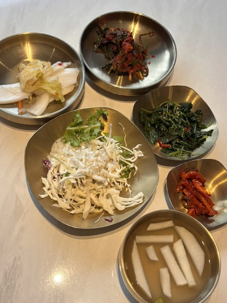 Basic side dishes and bottled water set on the table