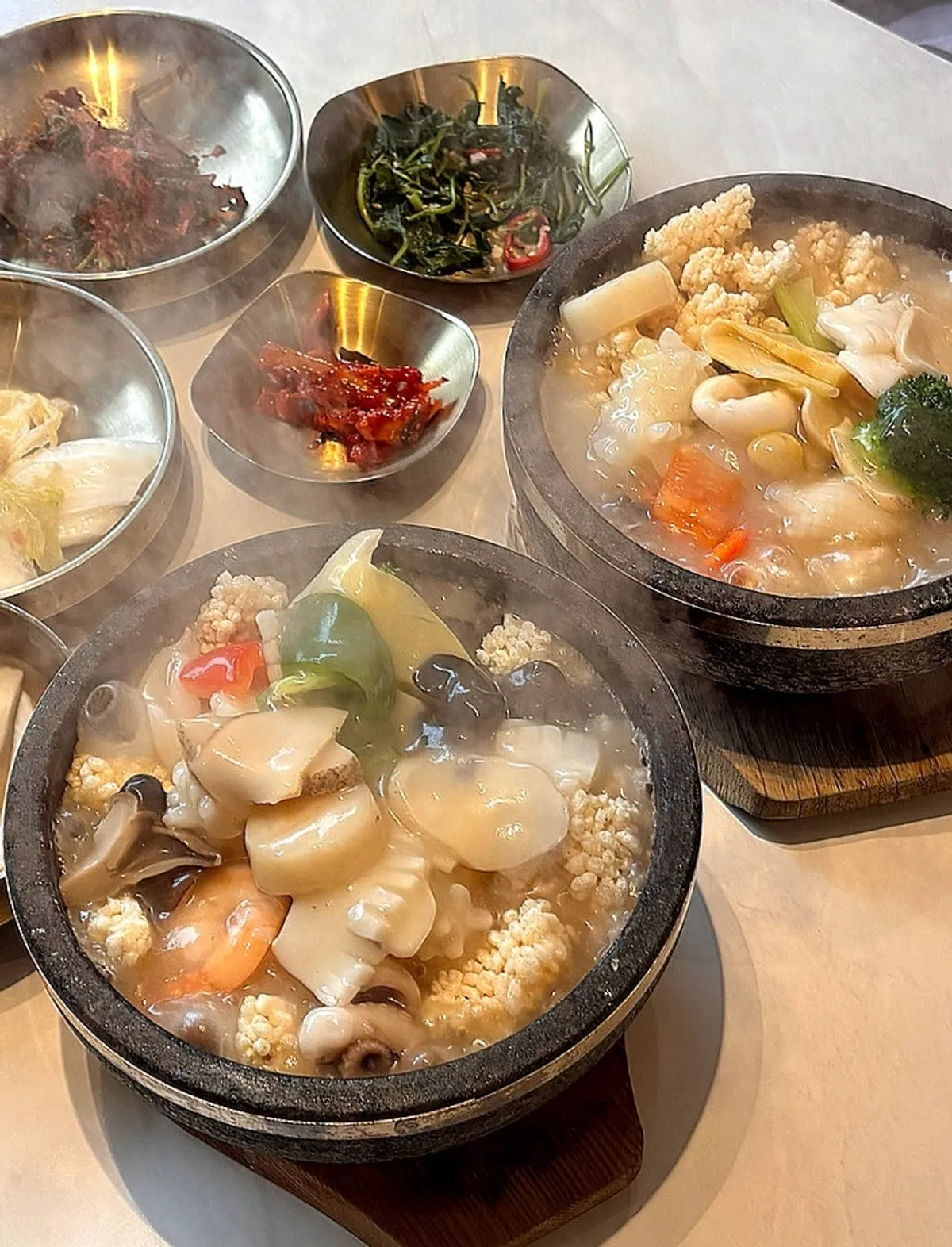 Stone pot seafood nurungjitang with steam rising